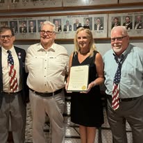 Past Exalted Rulers J. Yuschak, Steve Chase and Thomas Middleton with Exalted Ruler Caroline D. Martin holding Bristol Lodge No. 1010's 120th Anniversary Proclamation in the Pine Room